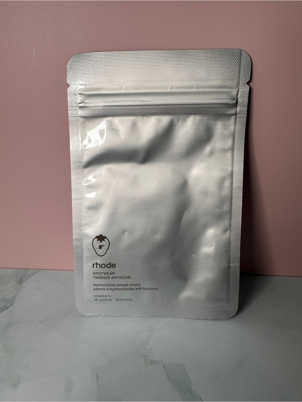 RHODE Hydrocolloid Pimple Patches – White on Pink Backdrop
